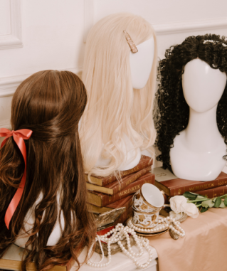 Woman selecting hair color samples in a salon, showcasing shades of brown and blonde.